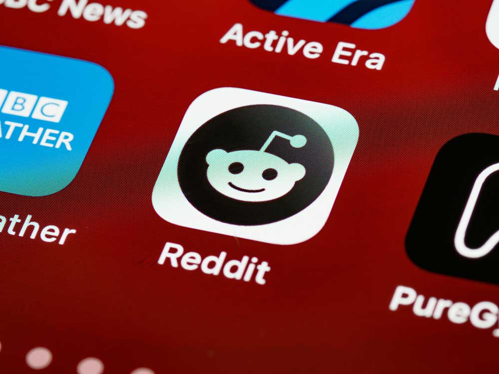 The Reddit logo on a phone screen.