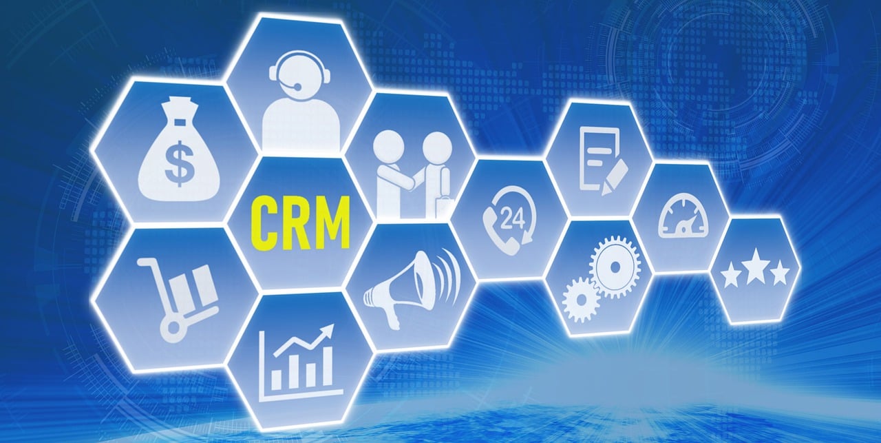 A graphic displaying CRM and multiple icons relating to Customer Relations Management systems.