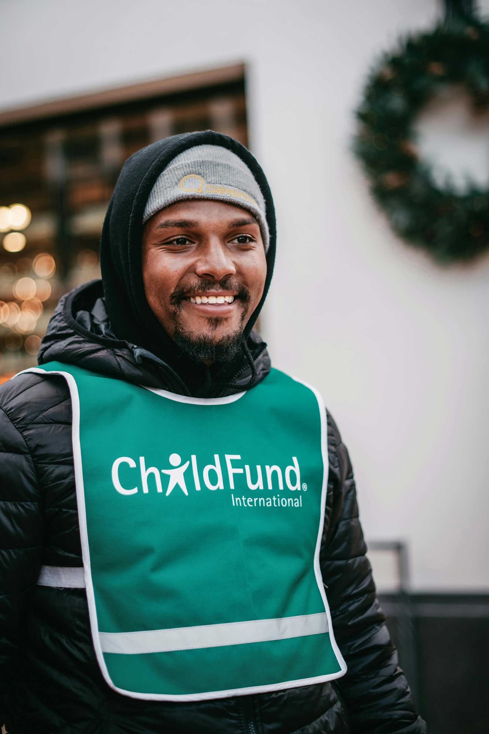 A Cleveland nonprofit worker wearing his organization on his vest.